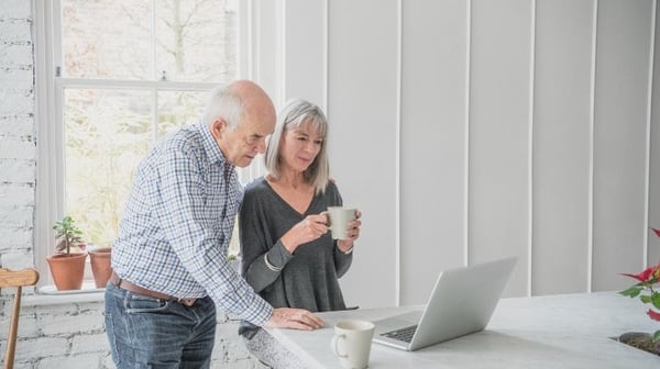 Senior couple looking at laptop