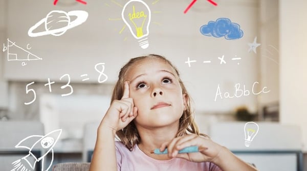 Image of school aged girl solving maths sums