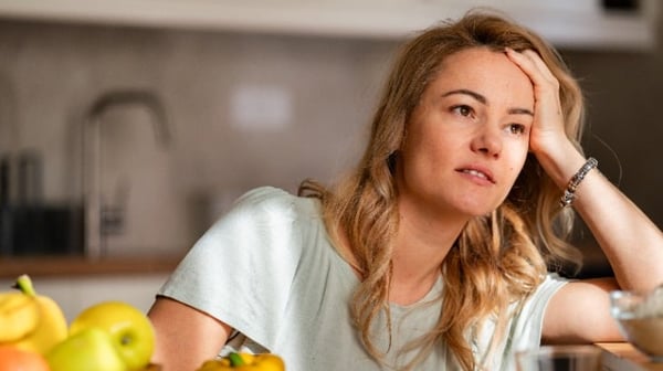 Image of a woman looking stressed