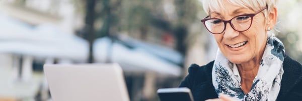 Smiling womna looking at laptop