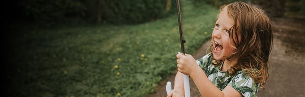 Young girl holding umbrella