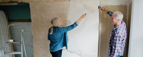 Couple decorating room