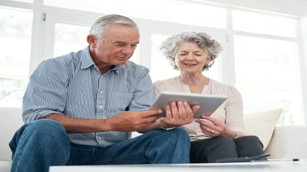 consumer - over 50s - IMAGE - Article Couple using I pad 730 X 411