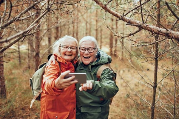 Senior women taking a selfie out walking