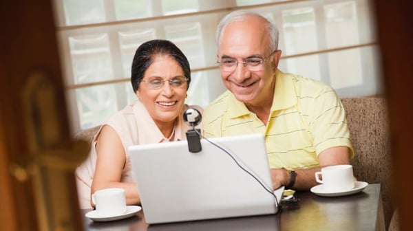 Senior couple using video conferencing