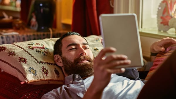 Man looking at tablet